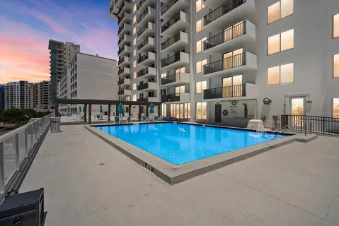a view of a swimming pool with a lounge chairs