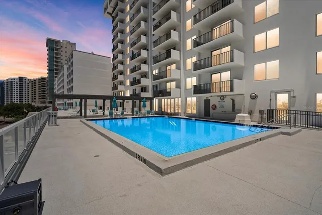 a view of a swimming pool with a lounge chairs