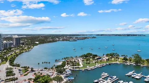 an aerial view of a houses with ocean view