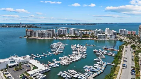 an aerial view of a houses with ocean view