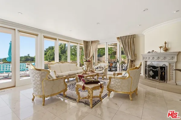 a spacious bedroom with a bed and a flat screen tv