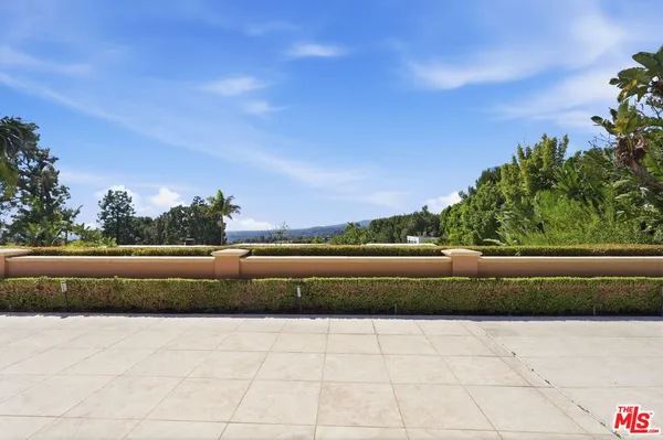 a view of swimming pool from a balcony