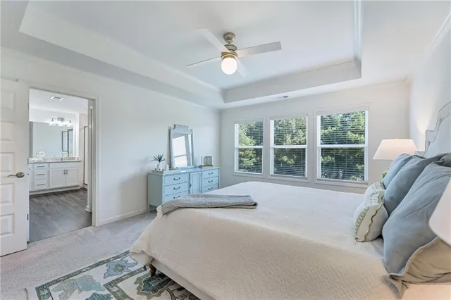 a bedroom with a large bed and a large window