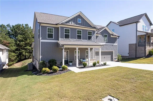 a front view of a house with outdoor seating