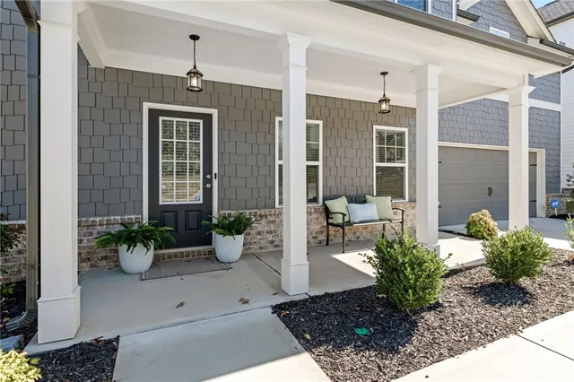 a potted plant sitting in front of a house