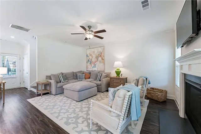 a living room with furniture fireplace and flat screen tv