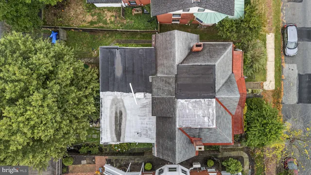 an aerial view of a house with a yard