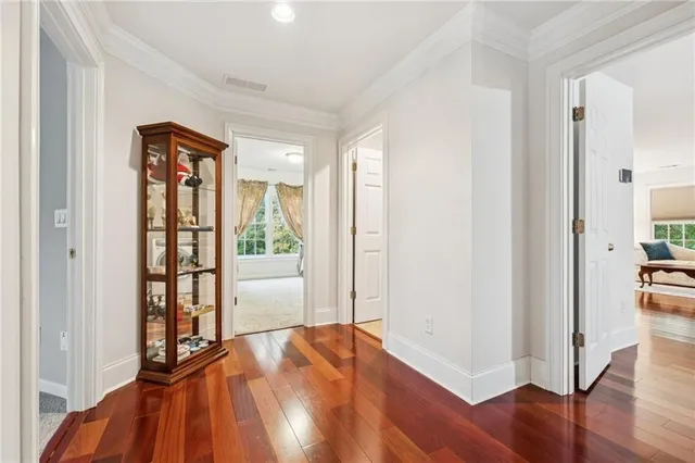 a bedroom with a bed a couch and a large window