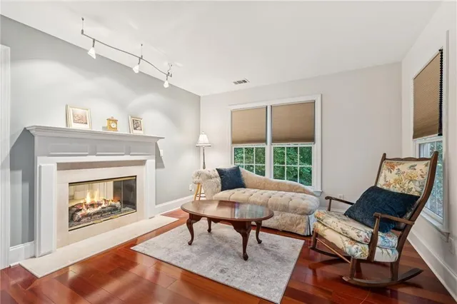 a view of room with furniture and a fireplace