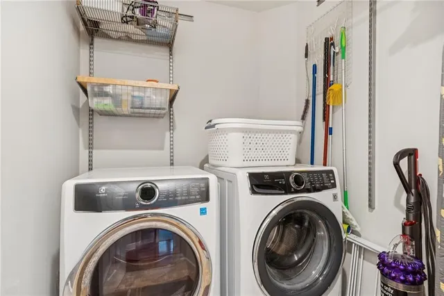 a living room with furniture kitchen and a window