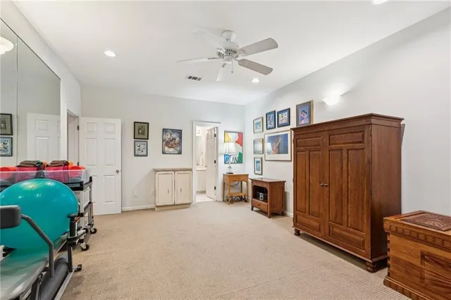 a front view of a house with a yard table and chairs