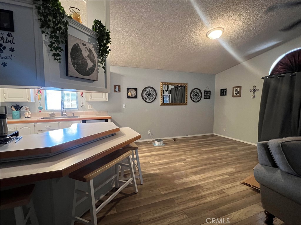 2020 Ashby Road, Unit 22 Merced, CA 95348 - Photo 14 of 25 a bathroom with a sink a mirror and a toilet