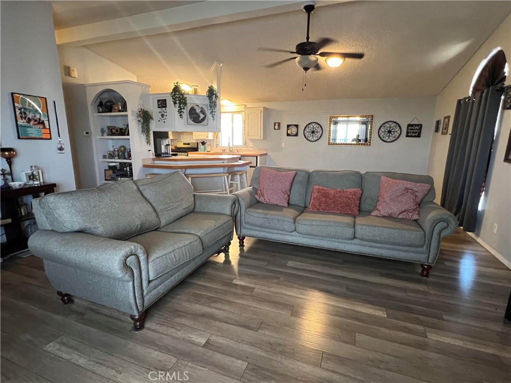 2020 Ashby Road, Unit 22 Merced, CA 95348 - Photo 8 of 25 a living room with furniture and a chandelier