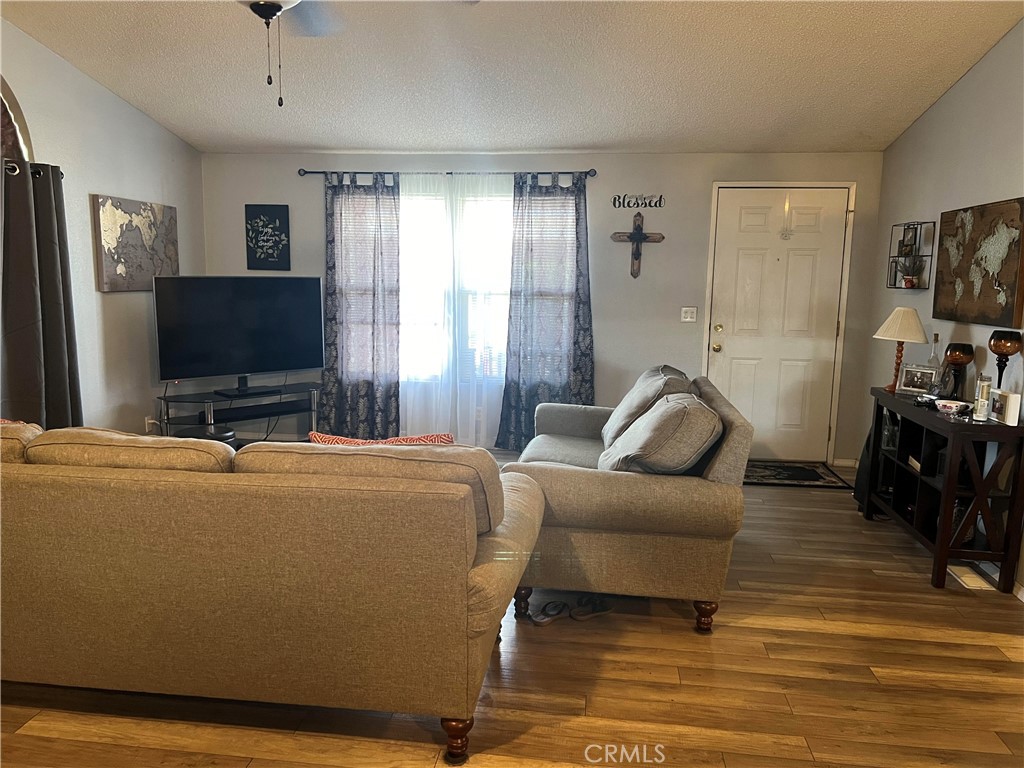 2020 Ashby Road, Unit 22 Merced, CA 95348 - Photo 9 of 25 a living room with furniture and a flat screen tv