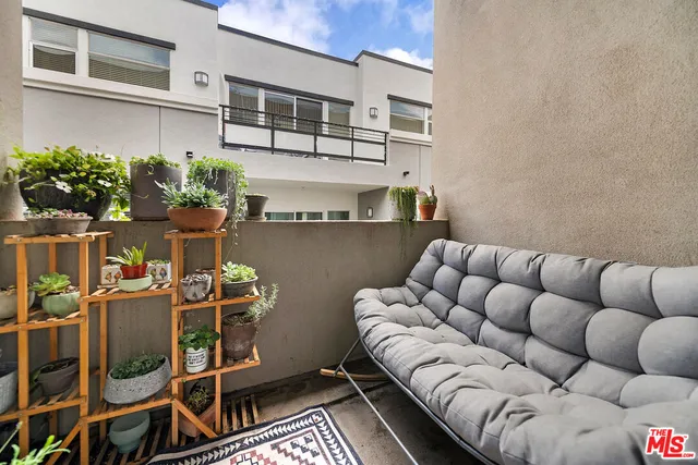 a view of balcony with outdoor seating
