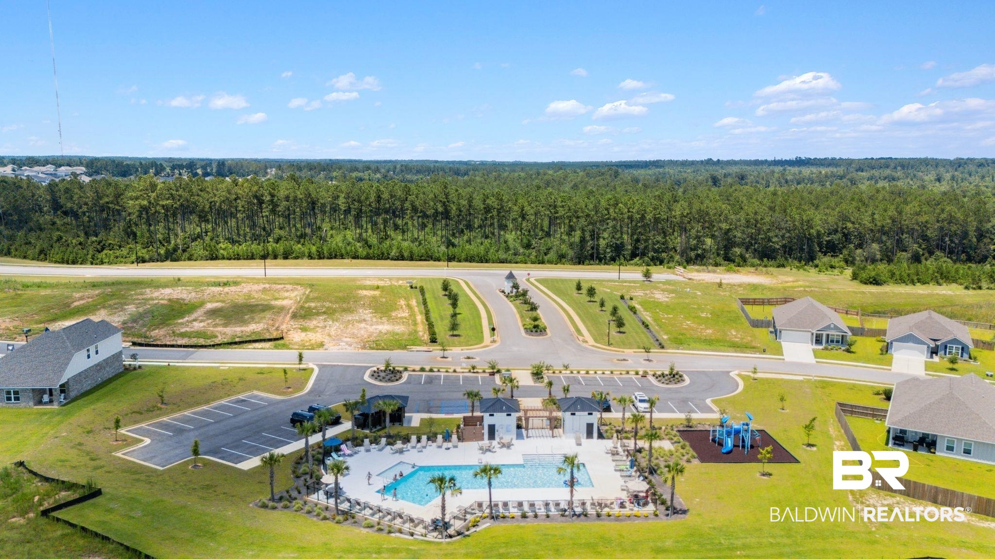 13966 Antler Hl Road Daphne, AL 36527 - Photo 39 of 44 Community amenities featuring a swimming pool, lounge seating, shaded cabanas, and an integrated playground structure