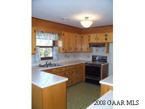 52 Purple Cow Road Waynesboro, VA 22980 - Photo 2 of 4 a large kitchen with a stove a sink and a refrigerator