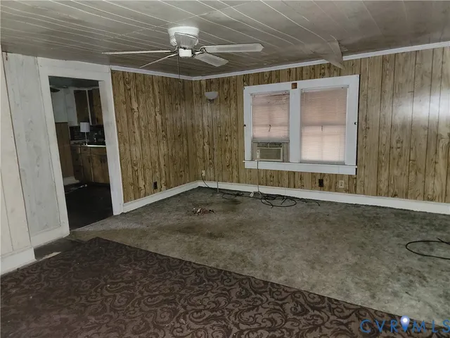 a view of an empty room with a window