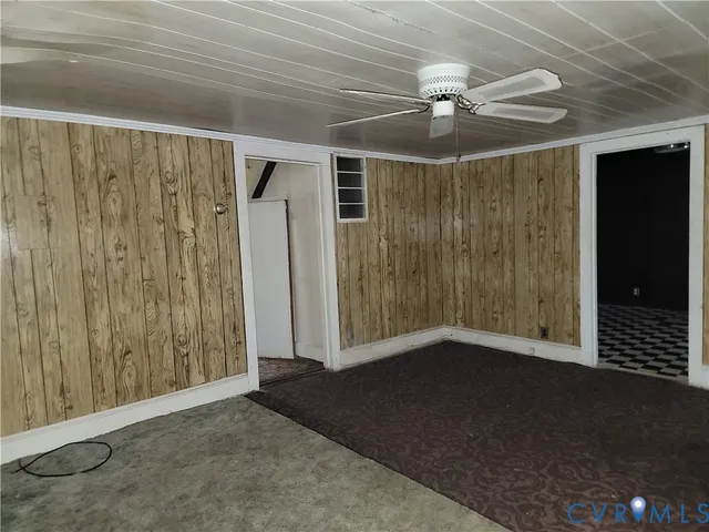 a view of a room with wooden walls