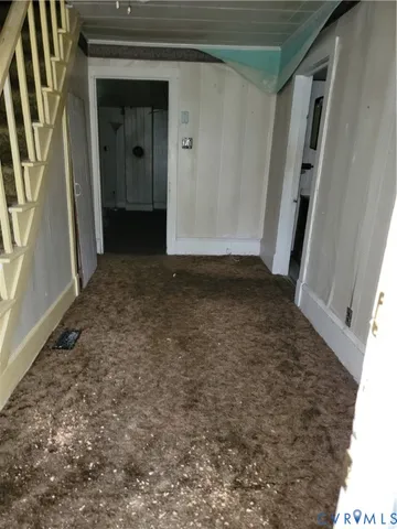 a view of hallway with rug