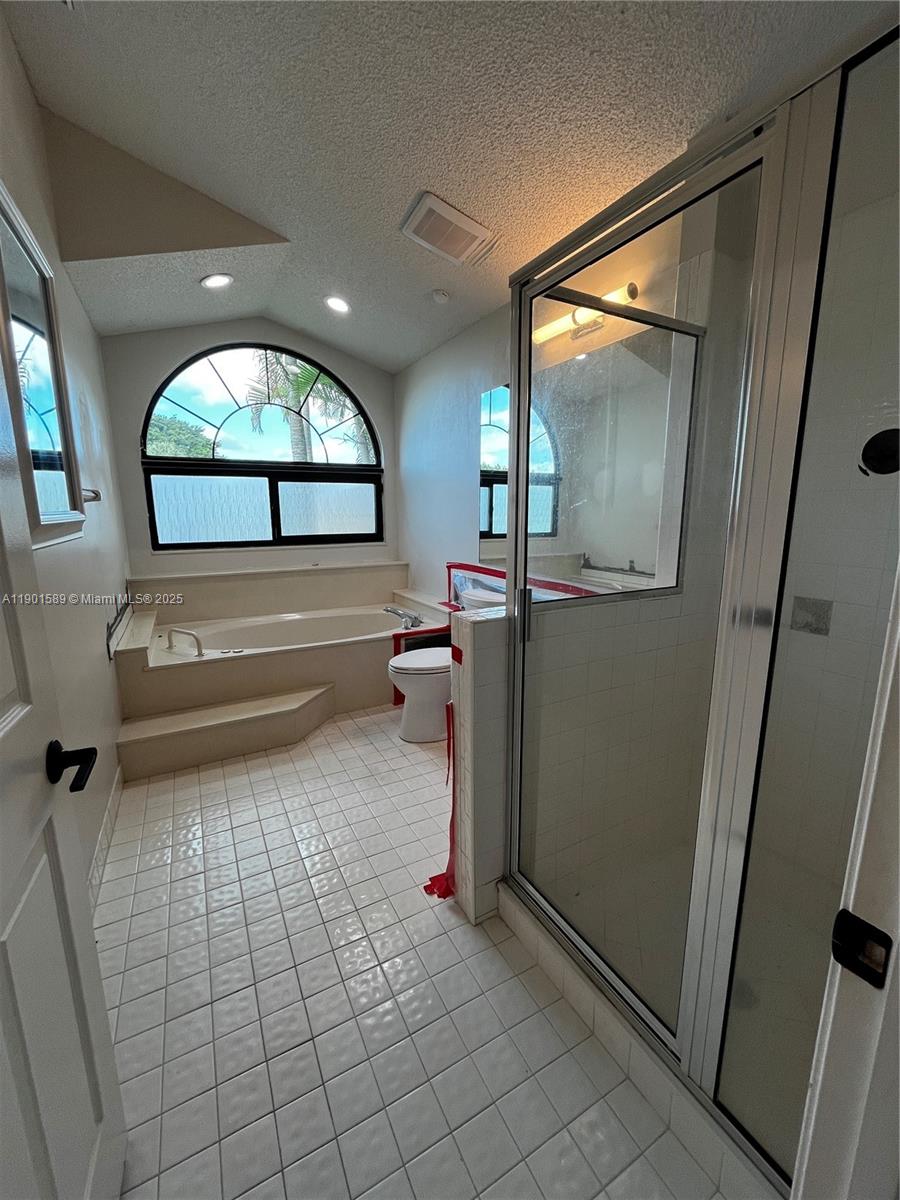 8079 Popash Court Boynton Beach, FL 33472 - Photo 13 of 30 a view of a hallway with wooden floor and furniture