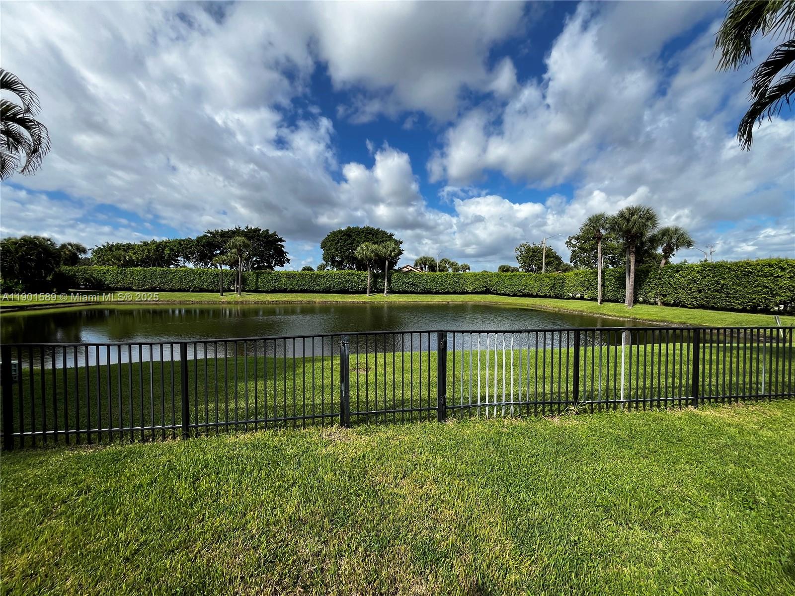 8079 Popash Court Boynton Beach, FL 33472 - Photo 25 of 30 a view of a yard with a lake view