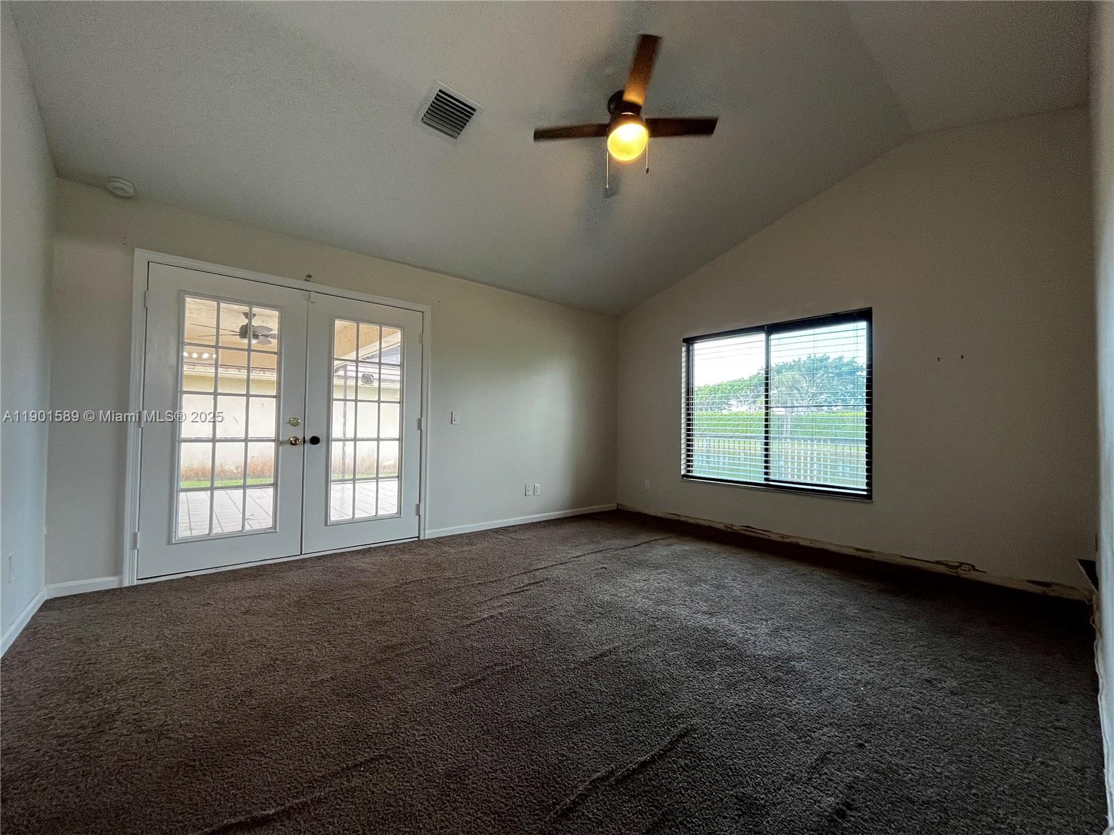 8079 Popash Court Boynton Beach, FL 33472 - Photo 10 of 30 an empty room with windows