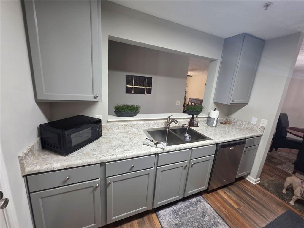 6102 Fairington Ridge Circle Lithonia, GA 30038 - Photo 10 of 22 a kitchen with a sink and a refrigerator