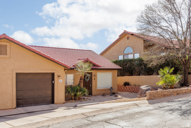 161 West 950 South, Unit S4 St. George, UT 84770 - Photo 4 of 21 Mediterranean / spanish home with stucco siding, an attached garage, and a tile roof