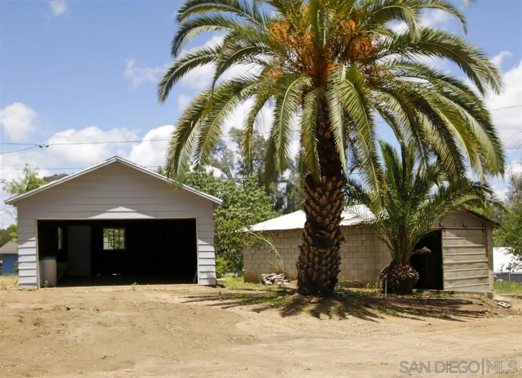 15726 Mussey Grade Road Ramona, CA 92065 - Photo 12 of 17 a front view of a house with a yard