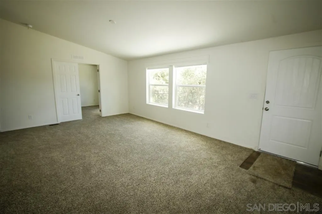 15726 Mussey Grade Road Ramona, CA 92065 - Photo 15 of 17 an empty room with windows