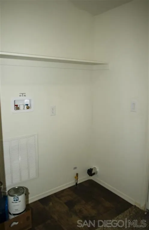 15726 Mussey Grade Road Ramona, CA 92065 - Photo 17 of 17 a room with water heater and wooden cabinets