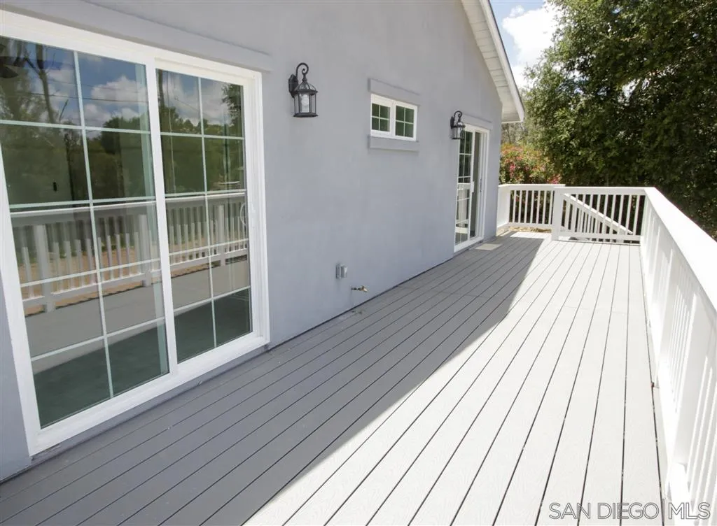 15726 Mussey Grade Road Ramona, CA 92065 - Photo 9 of 17 a view of balcony with wooden floor and fence