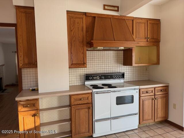 109 Franklin Avenue Tunkhannock, PA 18657 - Photo 5 of 18 a kitchen with wooden cabinets and a stove top oven