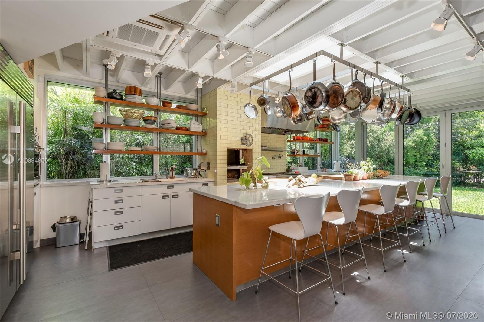 2801 Fairgreen Drive Miami Beach, FL 33140 - Photo 2 of 47 a room with lots of white furniture and a window