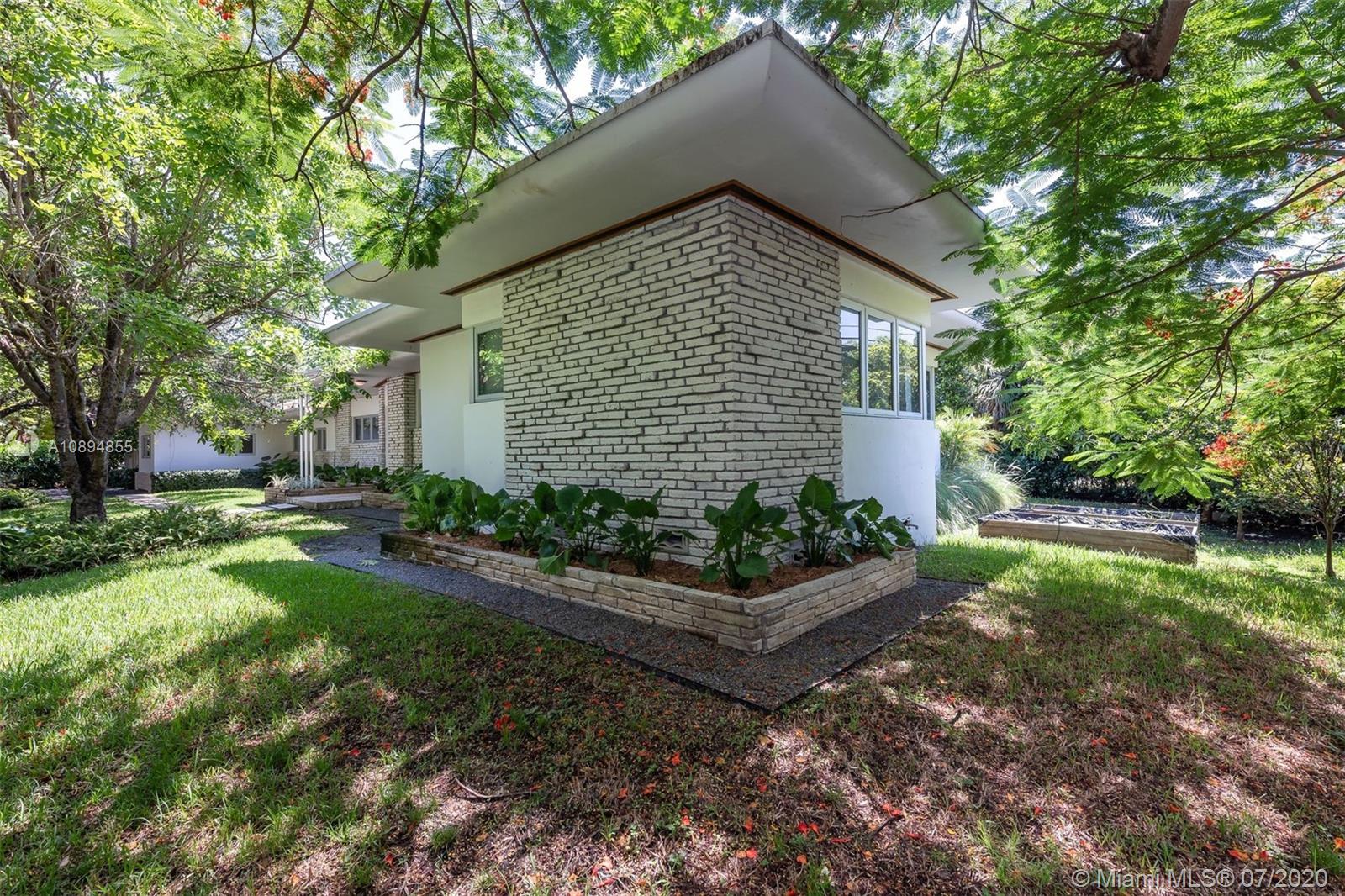 2801 Fairgreen Drive Miami Beach, FL 33140 - Photo 11 of 47 a front view of house with garden