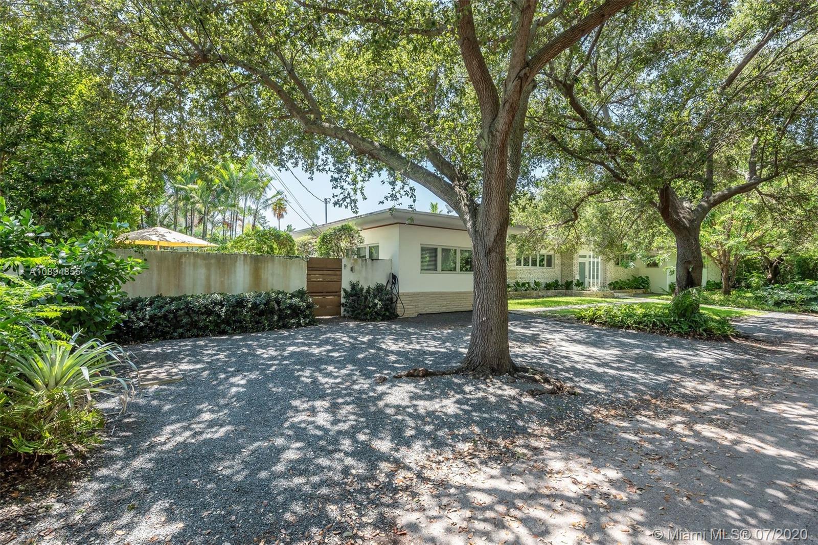 2801 Fairgreen Drive Miami Beach, FL 33140 - Photo 12 of 47 a view of a house with a yard