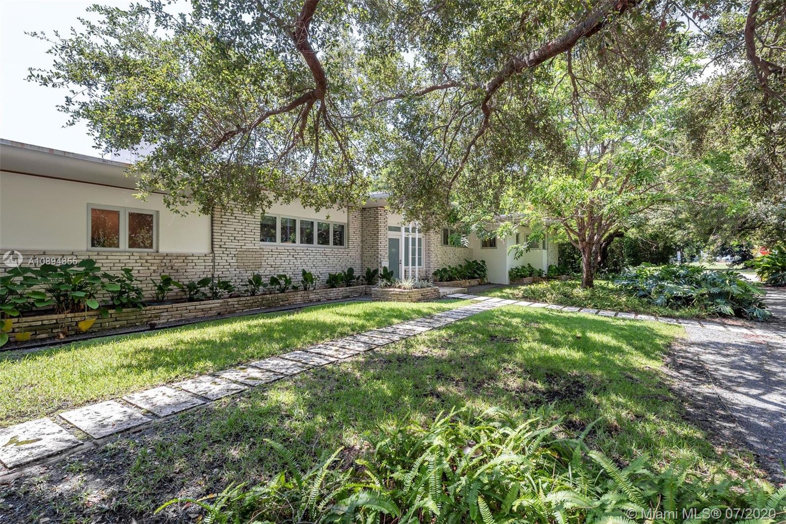 2801 Fairgreen Drive Miami Beach, FL 33140 - Photo 13 of 47 a front view of house with yard and green space