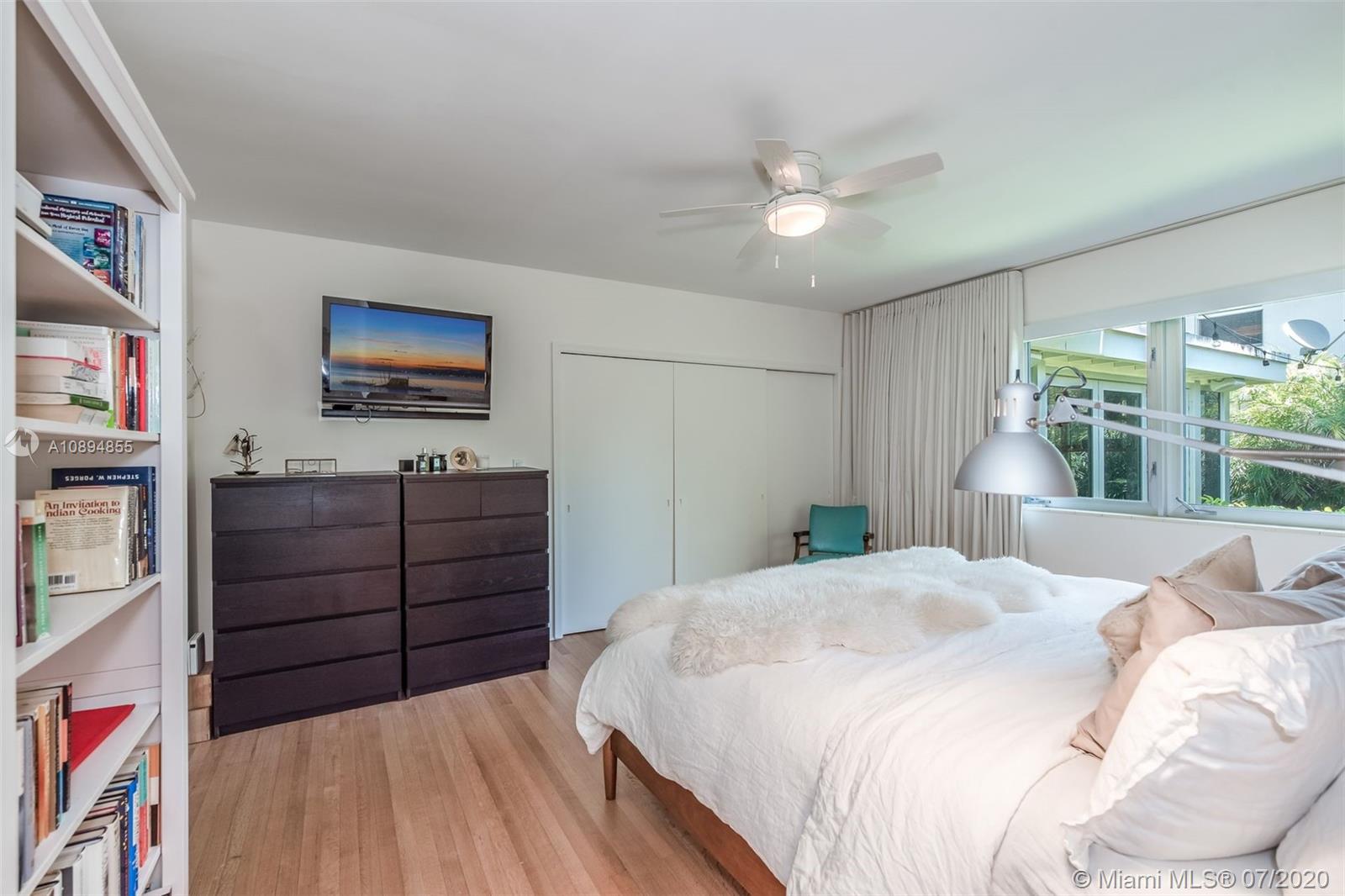 2801 Fairgreen Drive Miami Beach, FL 33140 - Photo 18 of 47 a bedroom with a bed and a flat screen tv