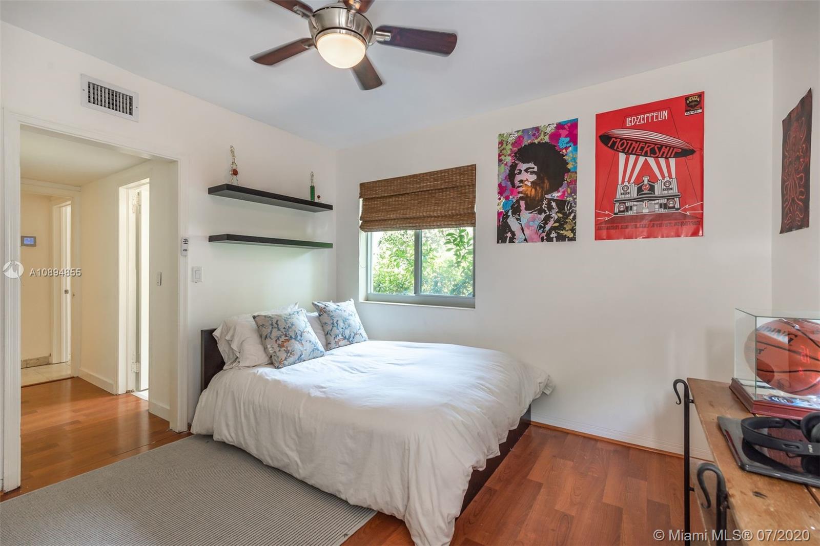 2801 Fairgreen Drive Miami Beach, FL 33140 - Photo 25 of 47 a bedroom with a bed and a window