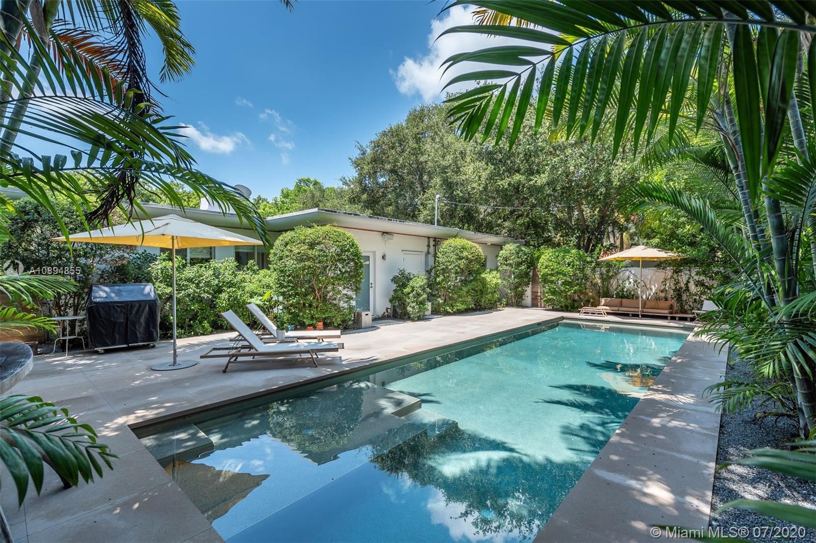 2801 Fairgreen Drive Miami Beach, FL 33140 - Photo 30 of 47 a backyard of a house with yard and outdoor seating