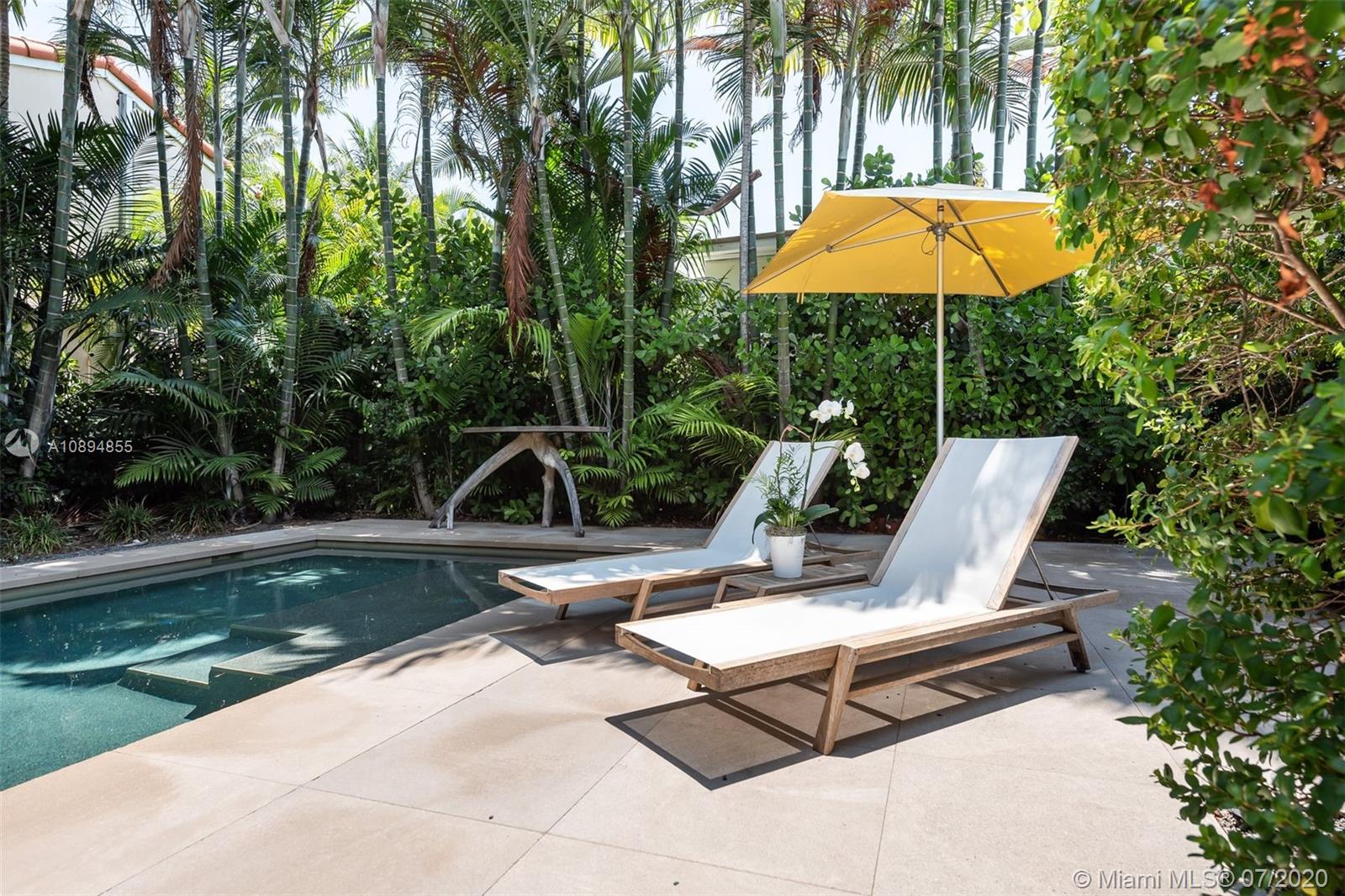 2801 Fairgreen Drive Miami Beach, FL 33140 - Photo 35 of 47 a view of a lounge chair and backyard