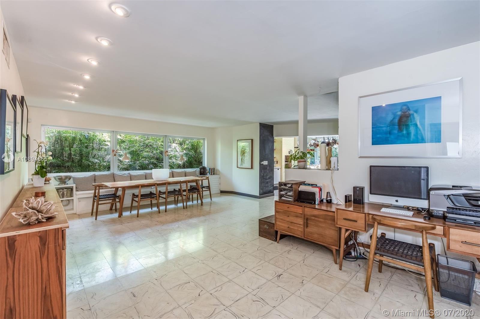 2801 Fairgreen Drive Miami Beach, FL 33140 - Photo 36 of 47 a living room with furniture and a flat screen tv