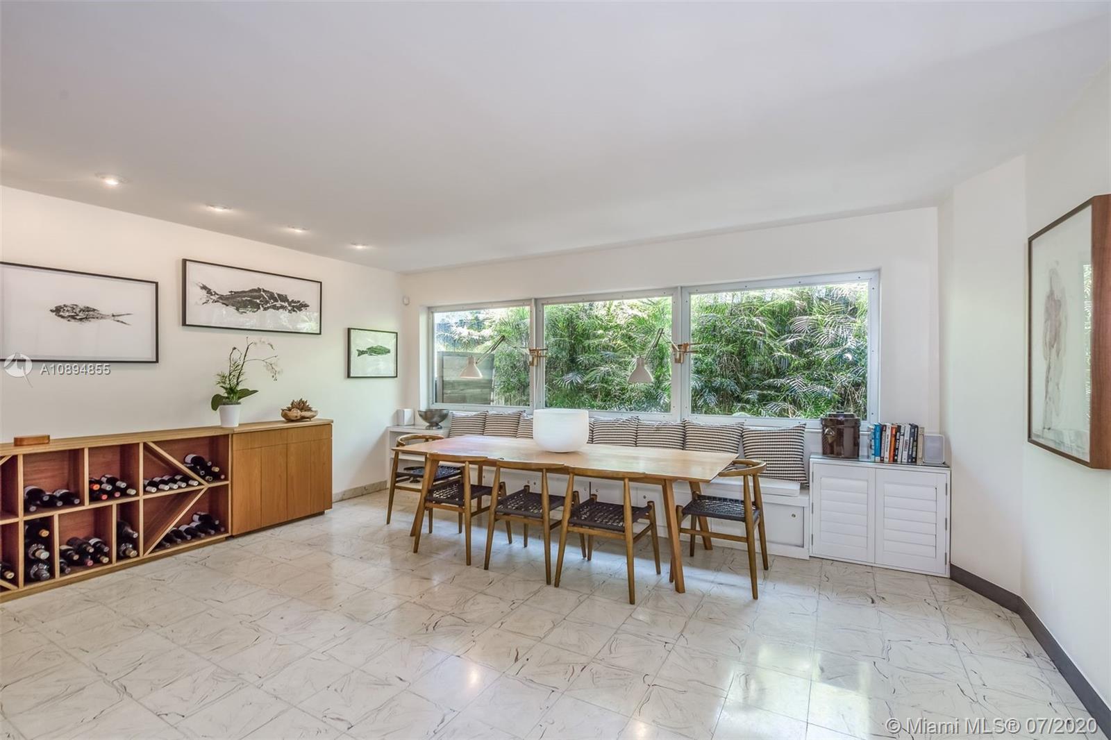 2801 Fairgreen Drive Miami Beach, FL 33140 - Photo 37 of 47 a view of a dining room with furniture window and outside view