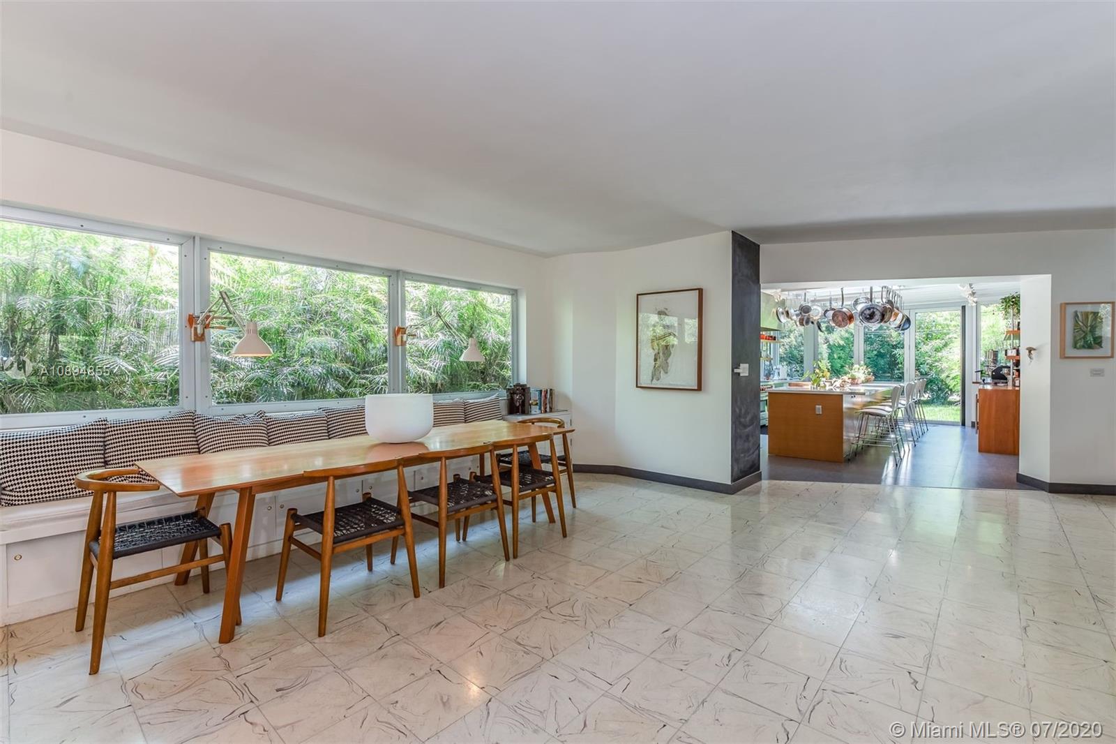 2801 Fairgreen Drive Miami Beach, FL 33140 - Photo 38 of 47 a view of a dining room with furniture window and outside view