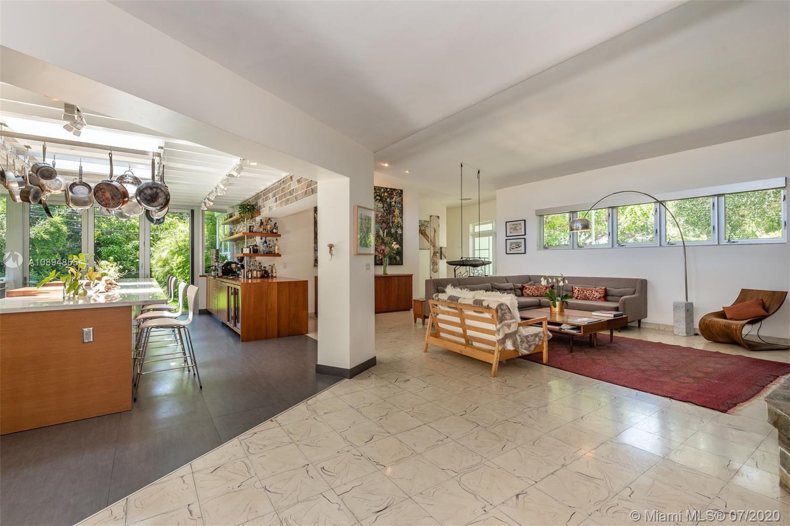 2801 Fairgreen Drive Miami Beach, FL 33140 - Photo 39 of 47 a living room with furniture and a large window