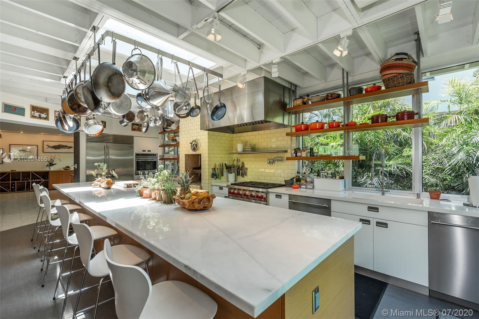 2801 Fairgreen Drive Miami Beach, FL 33140 - Photo 5 of 47 a kitchen with a sink a stove and a microwave