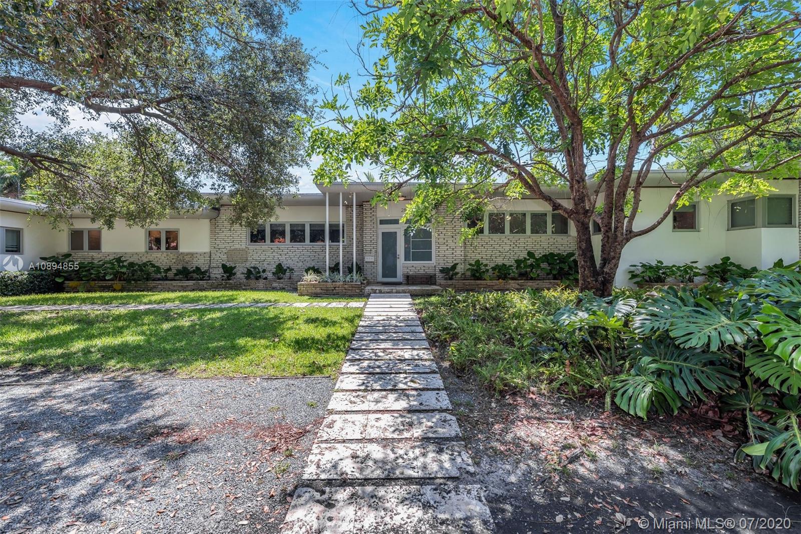 2801 Fairgreen Drive Miami Beach, FL 33140 - Photo 10 of 47 a front view of a house with yard and green space