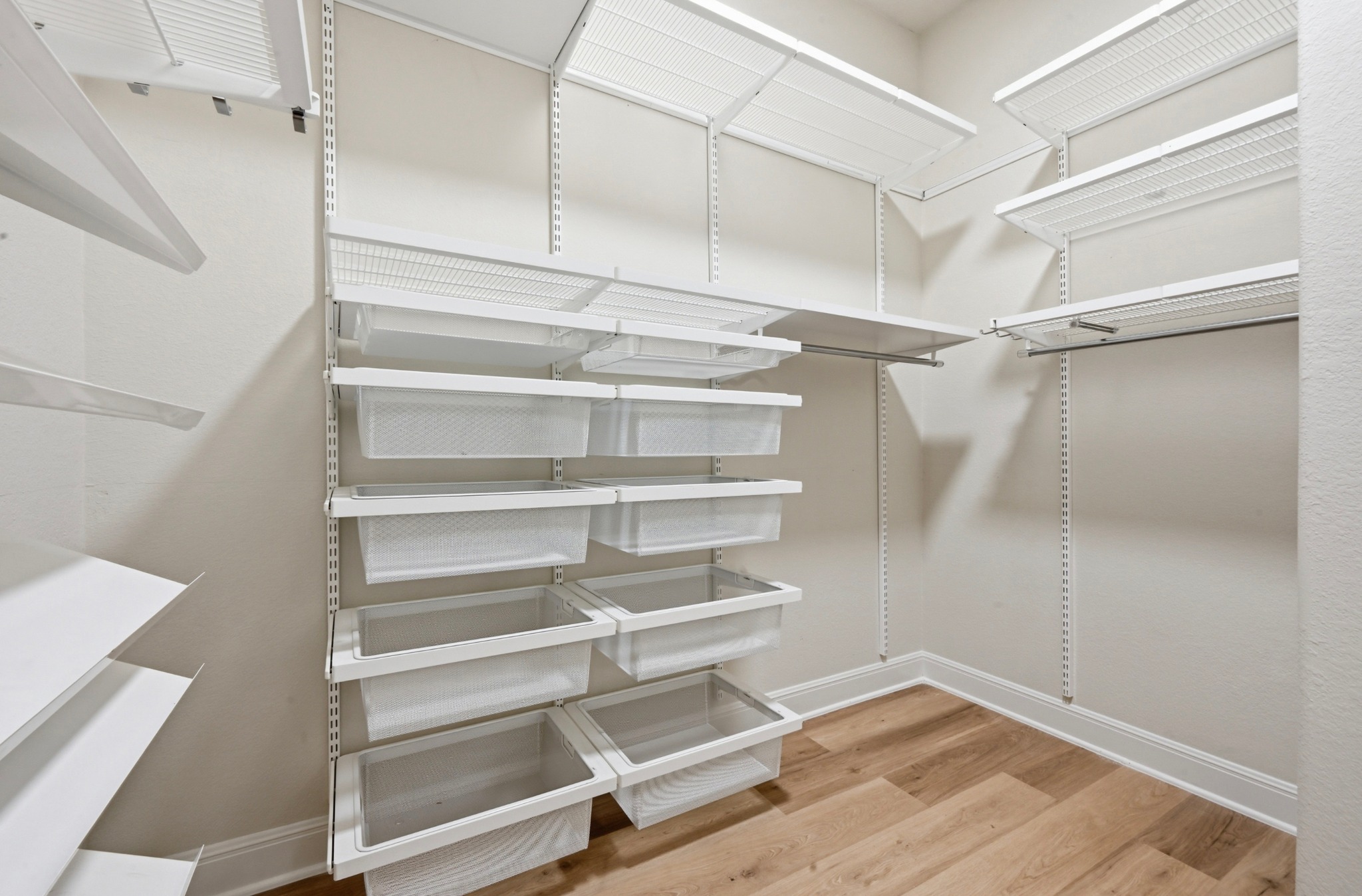 13009 Olivers Way Manchaca, TX 78652 - Photo 20 of 37 a view of walk in closet with empty racks