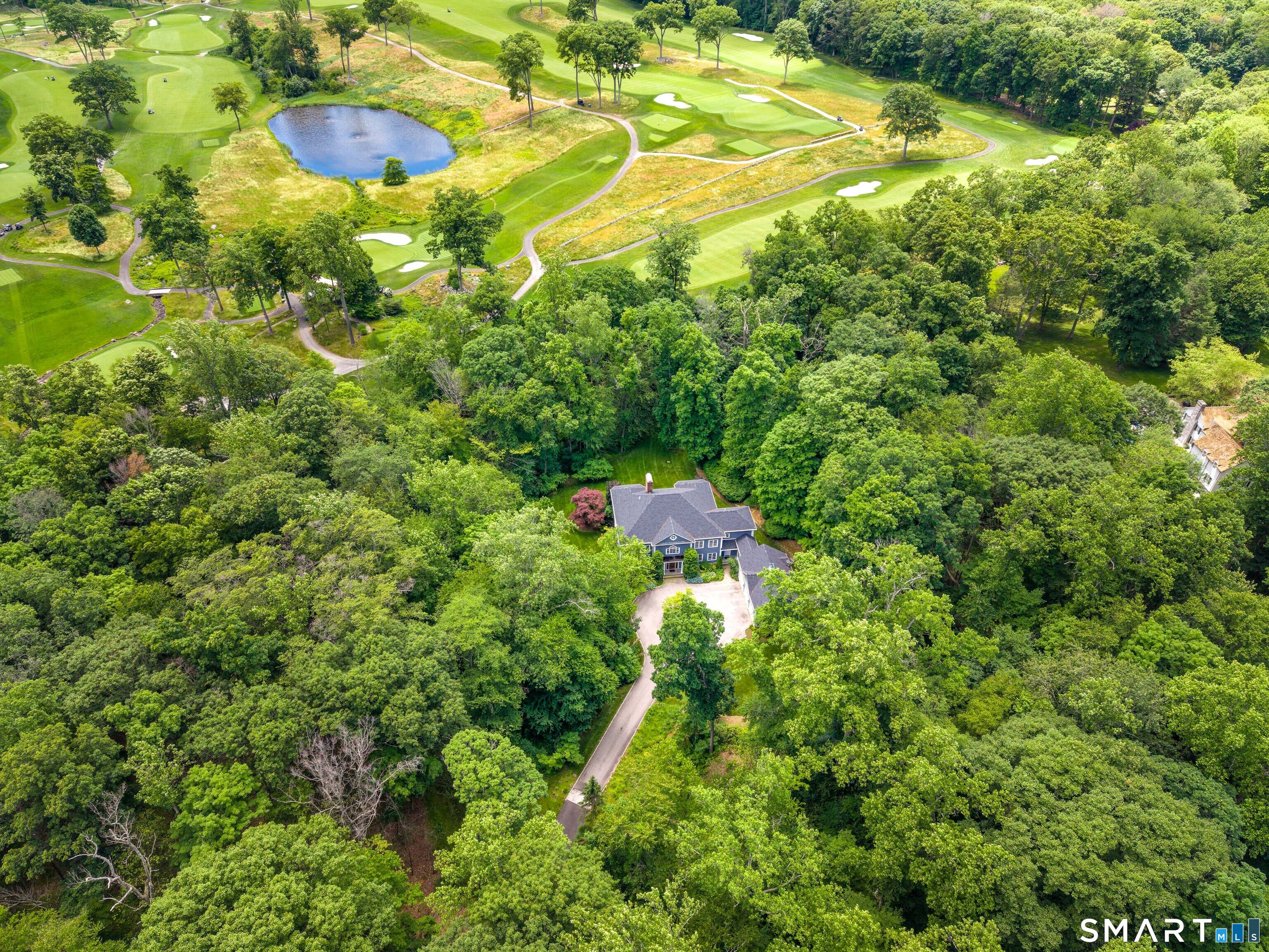 760 Smith Ridge Road New Canaan, CT 06840 - Photo 35 of 40 a view of a large yard with lots of green space